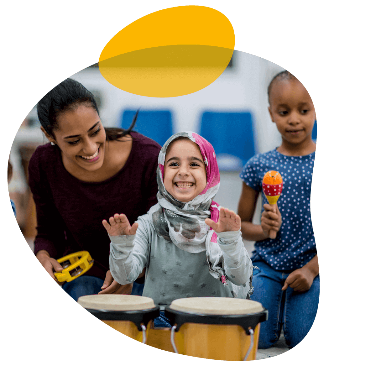 Children playing instruments along with a grown up