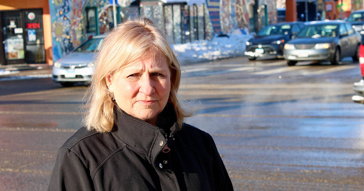 Woman standing on Lake Street in Minneapolis